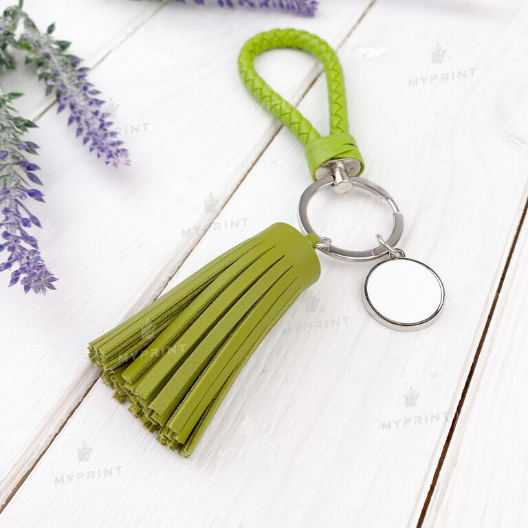 Keychain for sublimation round one-sided with a green cord and tassel d = 20 mm (7541)  Keychain for sublimation round one-sided with a green cord and tassel d = 20 mm (7541)